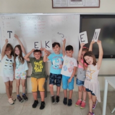 1st graders played game about English alphabet and numbers