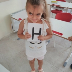 1st graders played game about English alphabet and numbers