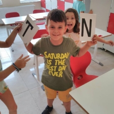 1st graders played game about English alphabet and numbers